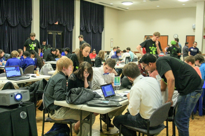 High school students write code for the game Minecraft at the WV State Science Bowl